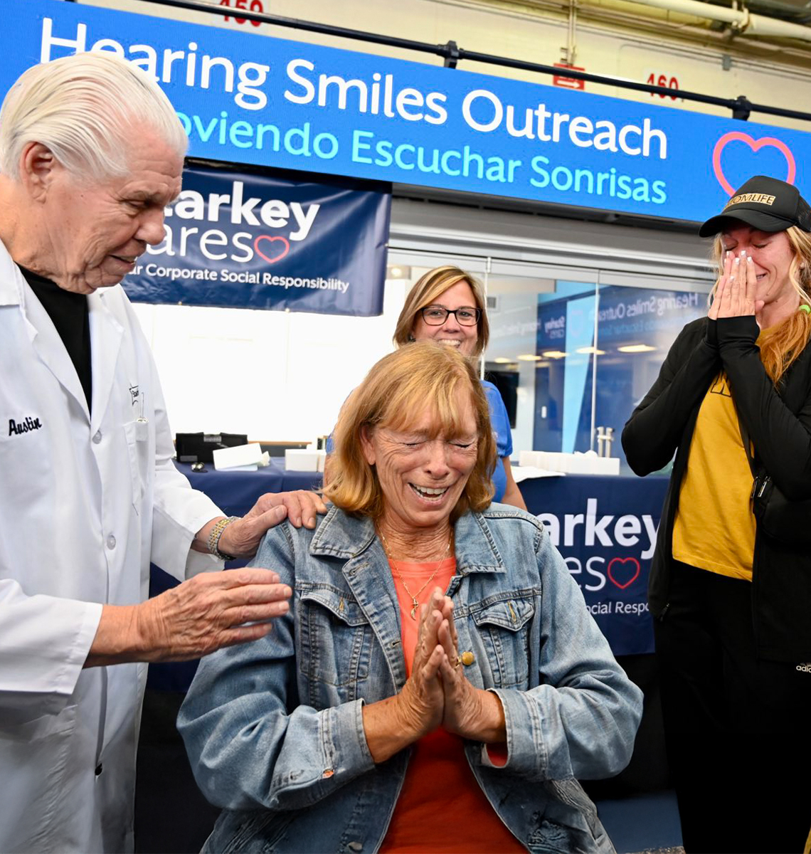 People smiling at Hearing Smiles Outreach